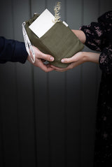 Two people exchanging a gift 