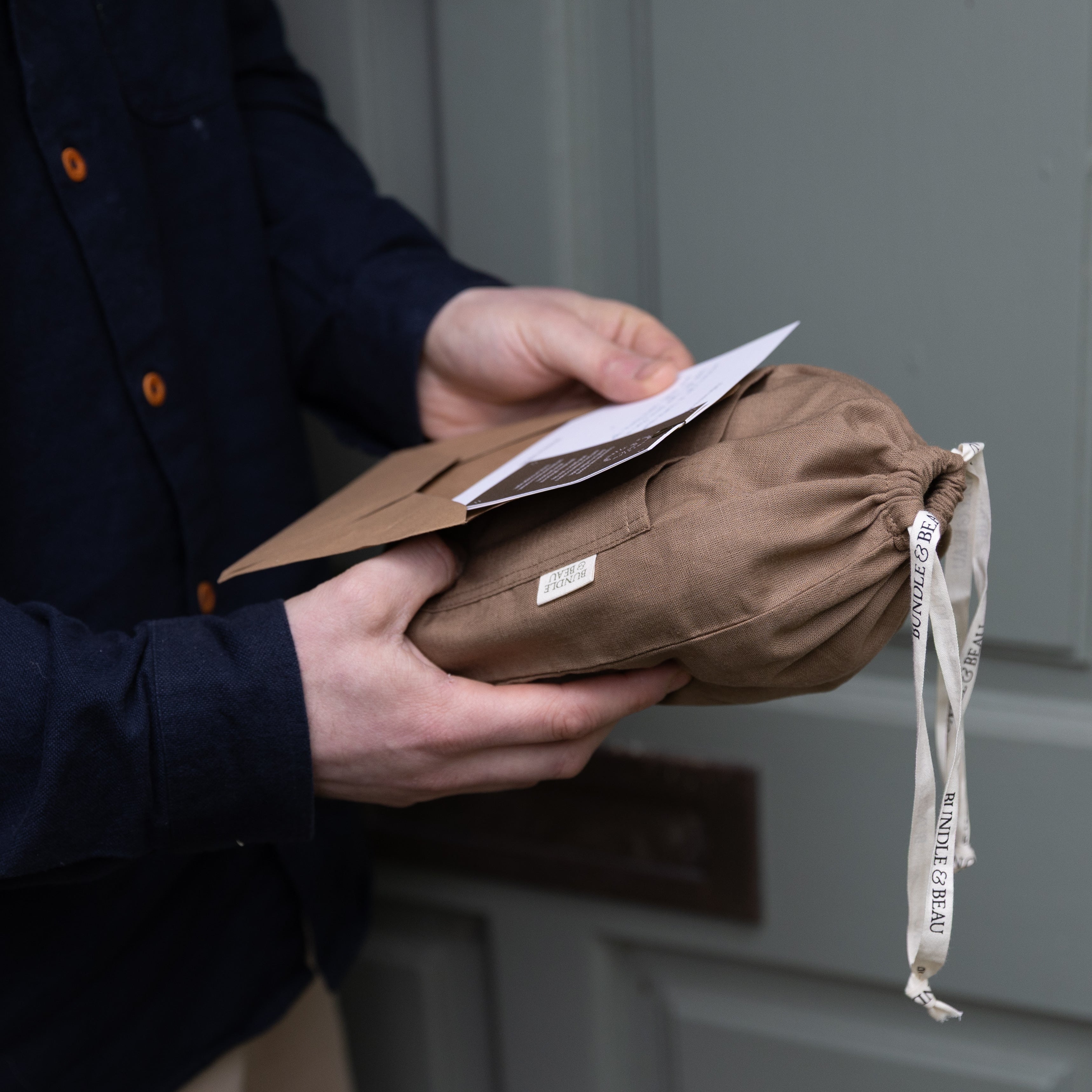 A man receiving a Bundle & Beau gift in the post