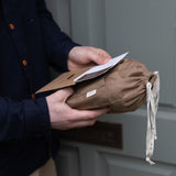 A man receiving a Bundle & Beau gift in the post