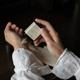 person applying a pulse-point roll-on