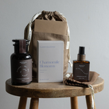 a calming gift bundle with bath salts, chamomile tea and lavender pillow mist